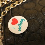 A guest's "I love writing" pin